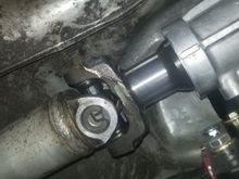 Fits like a glove, stock driveshaft is the perfect length!  A little bit more engagement wouldn't hurt, but there's still plenty of spline contact