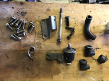 Header bolts, egr solenoid bracket, intake bolts, lots more in a box. 