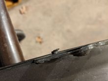 retention peg is snapped off on one side