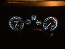 Gauge cluster with T10 5smd 6000K LED bulbs installed.  These are cheaper Chinese off-brand LEDs.  Weaker in lumens than a name brand but still way brighter than the original incandescent bulbs.