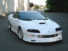 Here's my custom '96 Z28 that I built a few years back. (2006) It has an SS hood, Wings West ground effects, a Billet grille, Clear Corner turn signal lenses etc...etc...