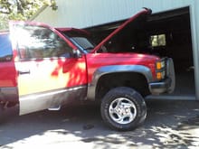 another picture when i went to buy somthing. its a 1992 chevy blazer fullsize. tbi 350, turbo400 transmission, 4in suspension lift, grille guard, lund visor, off road lights, dual exhaust all the stuff a red-neck like me needs!