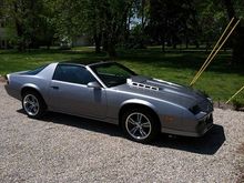 Camaro with new wheels and tires before hood work and black decals