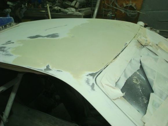 Started sanding out the passenger front corner but left it high until I get the other side rouged in and the mid section of the roof in bondo.