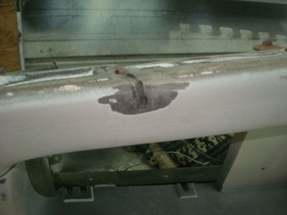 This was a tear on the lower center where one of the lower deflector mounting hardware had been ripped out.
