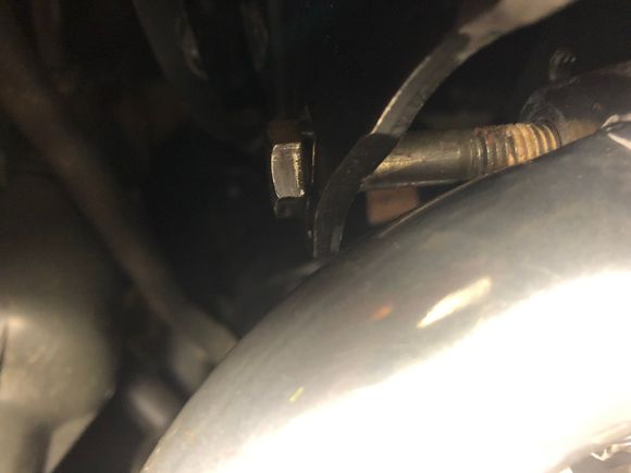 Bolt head appears to be roughly parallel to the original hole location on the bracket.