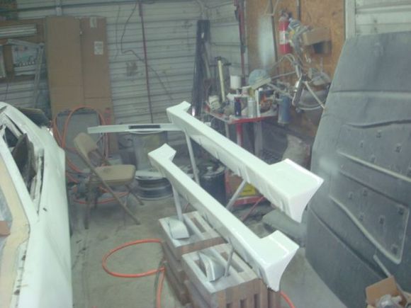 First 2 coats of epoxy on the ground effects and rear spoiler.