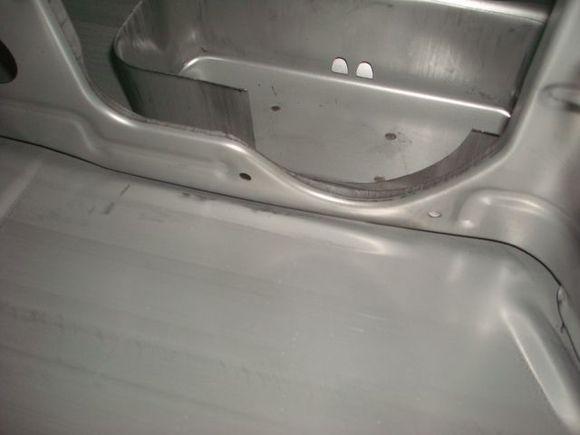 Metal baffling/slosh wall.