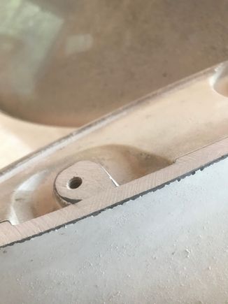 Then I ground the outer edges of the outer mounts to get them closer to the contour of the deck lid. I stopped when I got it flush with the stud mounting hole.
