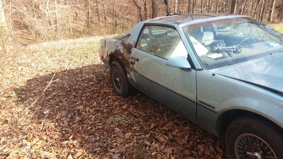 Its an 83 se 305 5spd that someone took care of until this happened in 95. She sat until i bought it last spring for next to nothing. Actually never touched the carb other than replacing every inch of vacuem line. Alot of brake work was done and fuel was a bit of a problem but it never left me stranded. Im in the process now of trying to get this fixed. Anyone have a firebird within 150 miles of charlotte i could cut a "little" metal off of?