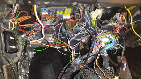 Cleaning up this awful mess. Someone installed an alarm and what a bad job they did. "Now wheres that  pink wire or was it yellow?" oh the hell with it cut em all out!