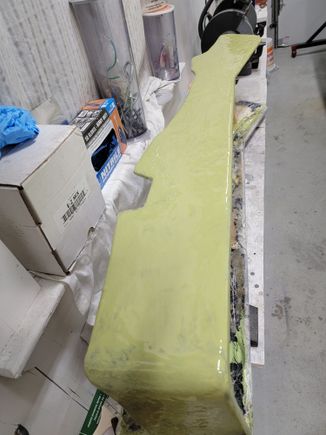 Rundo laying down a base of filler. 2 parts fiberglass resin, 3 parts bondo.