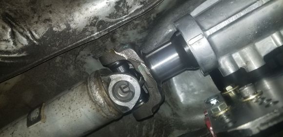 Fits like a glove, stock driveshaft is the perfect length!  A little bit more engagement wouldn't hurt, but there's still plenty of spline contact