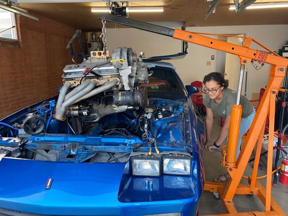My daughter helping me yank the motor.