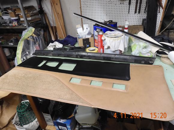 I decided to go with the black vinyl on this panel, left the old fabric with the padding. I think it will better meld with the black dash coming around the corner.  I only cemented the edges so the foam was unaffected.