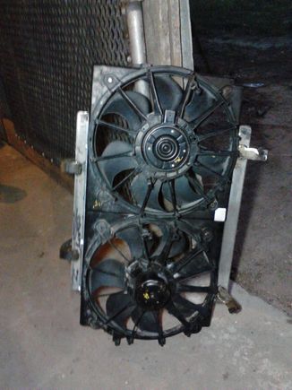 Here are the fans with the custom mounts bolted onto the shroud. I made the mounts out of some angle-steel and flat-stock. It bolts on using the factory mounting holes from the old fan.