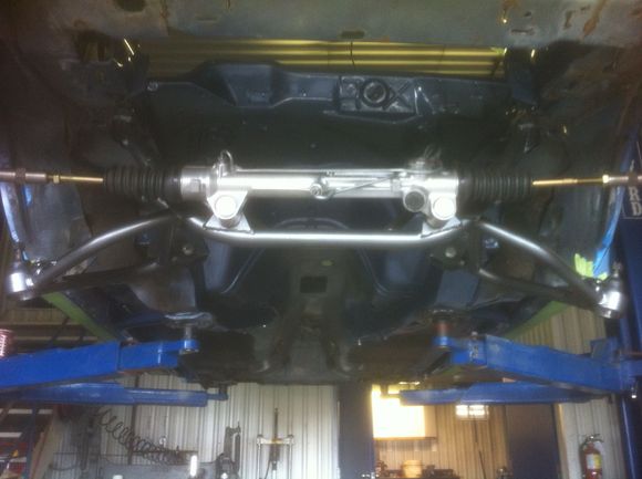 1. Re assembly begins. K member, control arms and rack are installed,