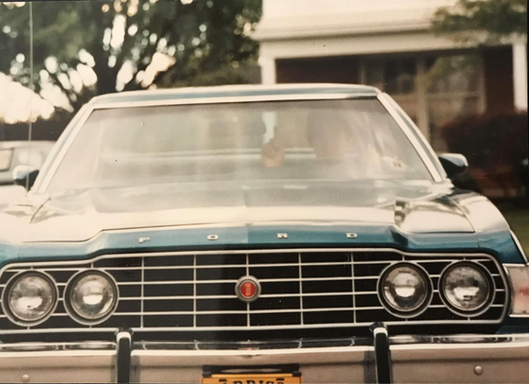 Me at 18 years old in my first car....1974 Ford Torino.  Note the #1 hand signal.