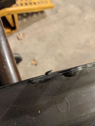 retention peg is snapped off on one side
