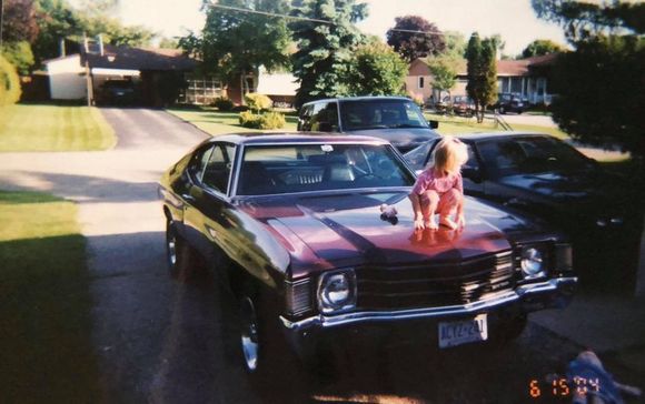 you can see the camaro off to the right,i sure miss the 6 car driveway....ive moved since then and my daughter(whos on the car) is a young woman now,time fly's