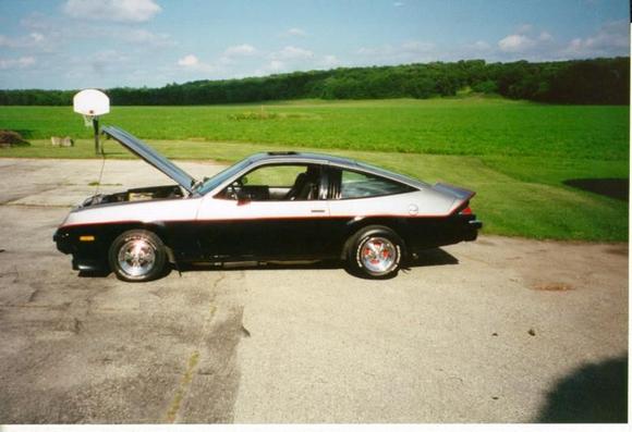 before we painted and with old rims. new paint looks purple should be blue. bad paint and bad paint job.