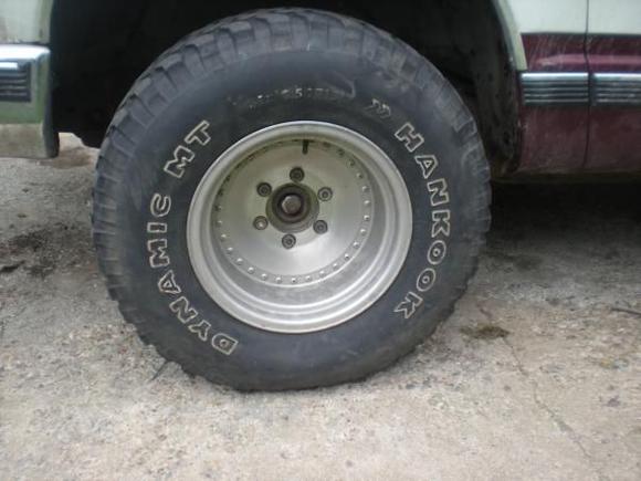 first losen the lugnuts on your wheel or wheels jack the truck off the ground enaugh so the tire or tires are off the ground use a jack stand to support the truck remove jack if so desired 
continue to remove lugnuts off wheel(s) 
remove tire

the process is the same for the right and left side in all teh photos and descriptions