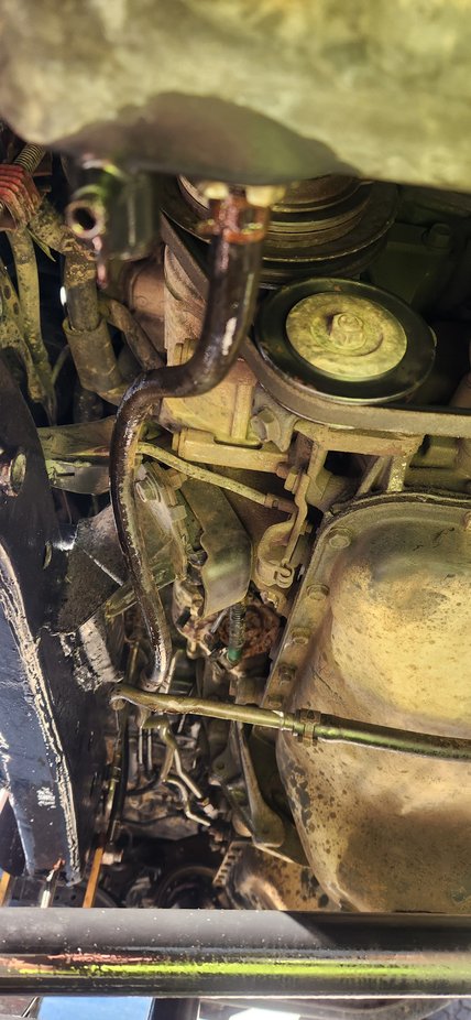 You can see here how the hose naturally wanted to sit and had been for sometime since the previous owner had put it together. Which i would like to compliment him on putting the truck together with not one hanger or support on the trans lines.