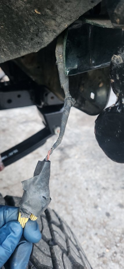 This is what i found tucked away in the inner fender. Too the previous owner or who ever did this. Please take all of your wrenches and tools and turn them in for scrap metal. NO TOYOTA deserves this level of disrespect. On the other side i was thrilled to see he atleast took the time to spray paint the wire nuts black before tucking them away. Called the owner, hes picking up truck up in two days from when i took this pic. Not enough time to order trail gears kit and install.