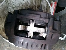 Here is my passengers side caliper that I later realized had both pistons on the outer side seized up. which meant an unexpected drive to that parts store to get new calipers. which ended up being a whole de-boggle on its own.