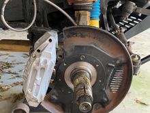 Trimmed the dust shield, test fitted with new caliper 