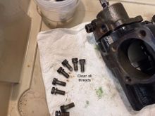 Lightly grease the power piston cylinder and o-rings and use two bolts to pull it until is seats. Then use the input shaft to center the gear teeth on the piston to the middle of its travel. The input shaft turns about 4.5 rotations so put it at 2.25 and you should be right about there. The flattend area on the input splines will be on the bottom if looking at the box in mounted position.