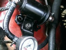 Fuel Pressure gauge mounted on original bracket (later attached to fender) Very easy to read from the front of the vehicle and away from most of the heat you would get closer to the intake