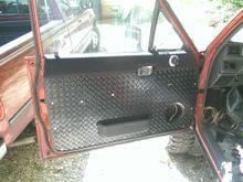 Driver's side (with original map pocket moved back and covered in fabric)