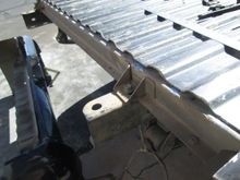 With the decision of at least 3 inches and probably more it became clear that the  final cut line had to go forward to stay clear of the tappered end detail of the ribs down at the threshold. This meant that the weld joint was now going to overshoot the crossmember. The fix was to turn the crossmember around backwards moving the flange forward