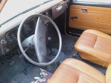 clean bucket seats, clean door panels, sprayed bedliner in the floor, shifting boot, steering wheel cover, clean dash