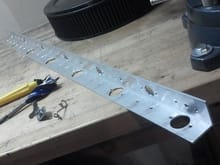 36&quot; x 1 1/2&quot; x 1/8&quot; Aluminum angle. I drilled the holes (poorly) myself.