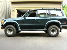 My car after the new struts and 32x12.5r15's are put on (and the back brakes are ground to clear the rims).