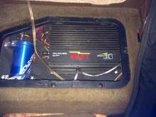 Amp and cap under the rear seat