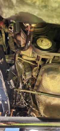 You can see here how the hose naturally wanted to sit and had been for sometime since the previous owner had put it together. Which i would like to compliment him on putting the truck together with not one hanger or support on the trans lines.