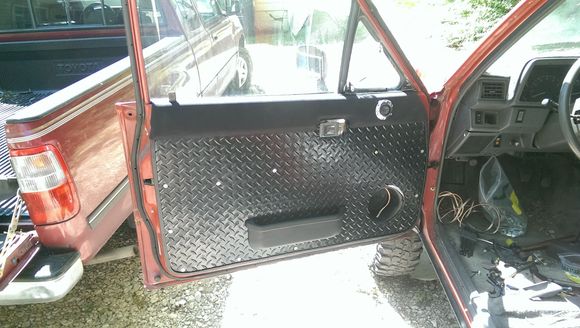 Driver's side (with original map pocket moved back and covered in fabric)