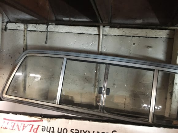84 pu rear sliding glass window, 
window slides, no latch inside.
Also have solid glass window in my 89, pretty sure they are the same, I will sell one or the other.... $150 or best offer
No Idea on shipping one of these..