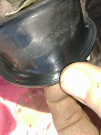 Minor cracking of the diaphragm. I coated it with permatex black and worked it into the crevices then gave it a topcoat