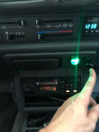 the light is on as long as the outlet is on, so you can keep the dust cover on it if the light bothers you.  