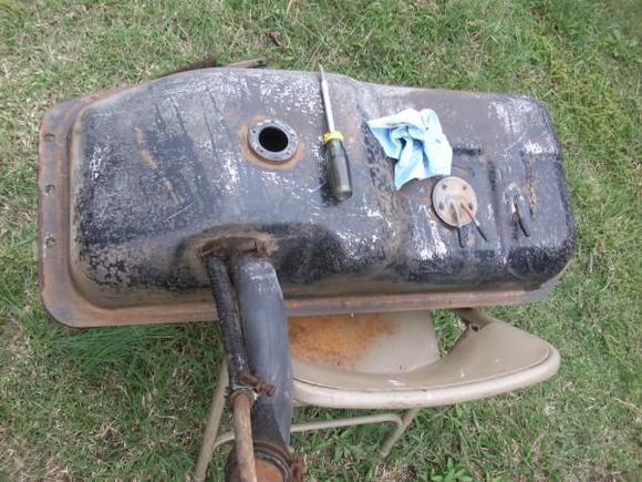 Tank with all the dirt knocked off along with some old paint...