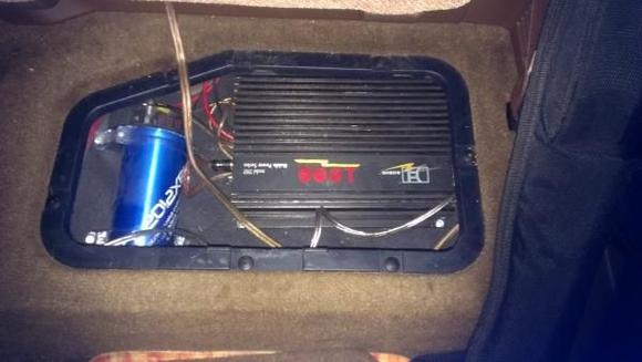 Amp and cap under the rear seat