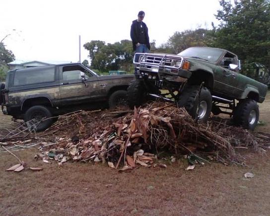 me and my buddy and his bronco II this pile of brush is bigger than it looks