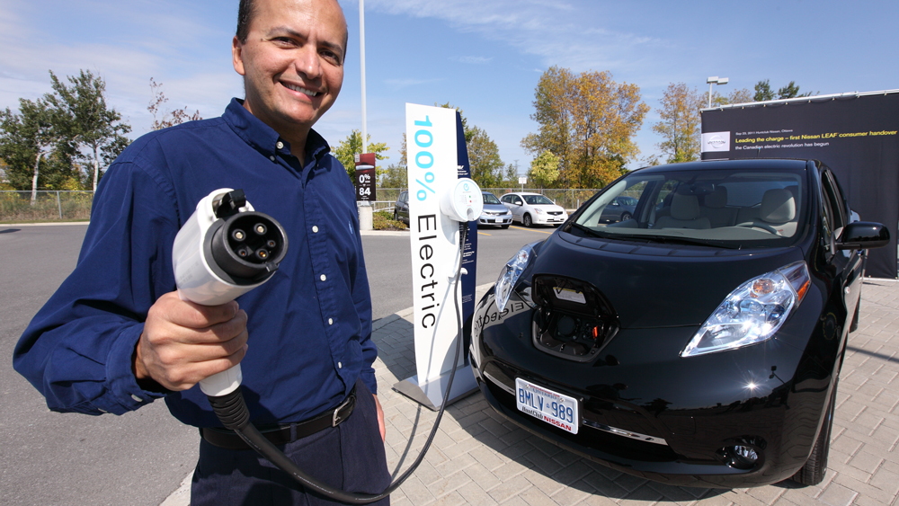 Ottawa resident Ricardo Borba takes delivery of the first consumer Nissan LEAF in Canada