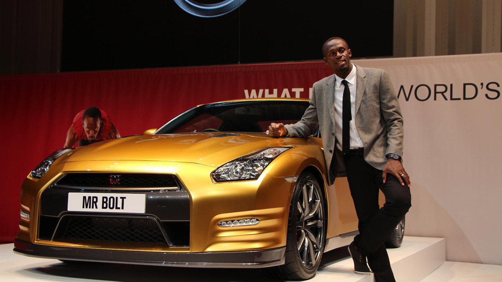 Usain Bolt and his personal gold Nissan GT-R
