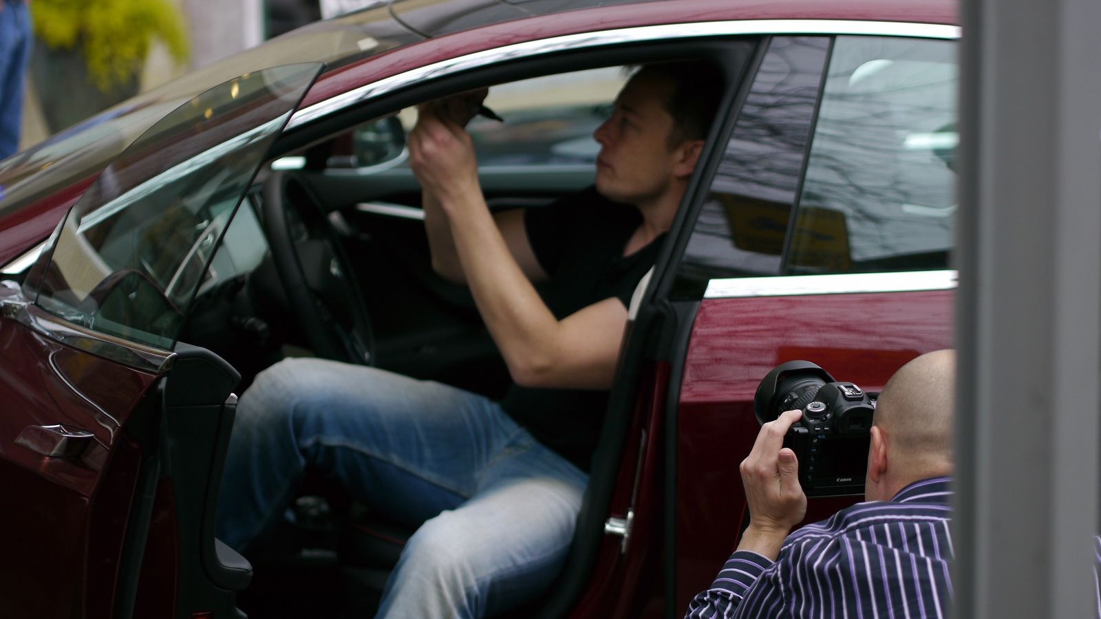 Elon Musk signs new 2013 Tesla Model S at Tesla Store opening, Austin, Texas [photo: John Griswell]