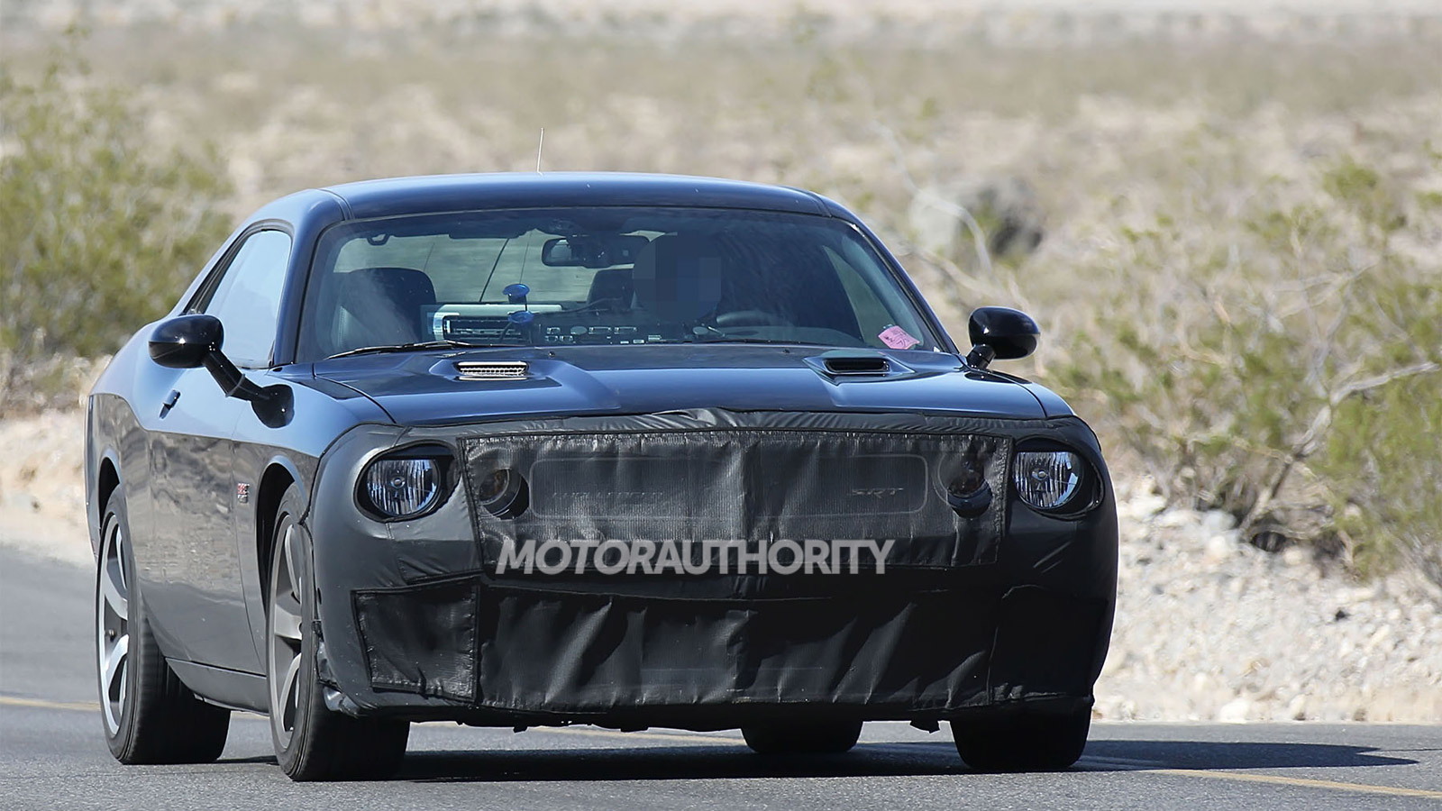 Spy shots of a 2015 Dodge Challenger SRT powered by the ‘Hellcat’ supercharged HEMI V-8